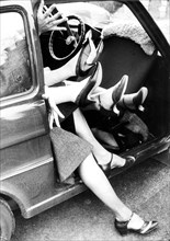 Many women in a car ca. 1970s