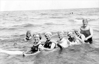 Six women bathing in the sea