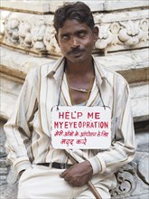 Blind man begging for an eye surgery