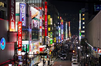 View into a street with illuminated advertising