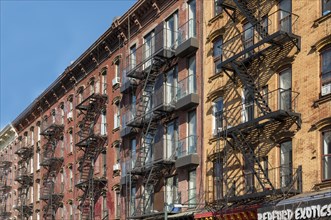 Facades with wrought-iron fire escapes on Bedford Avenue in Williamsburg