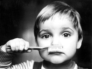 Child with toothbrush