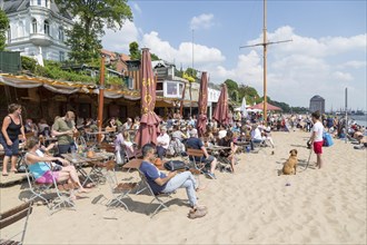 Many people in the restaurant on Elbe beach