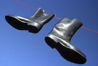 Rubber boot on clothesline