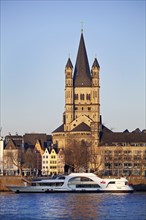 Rhine with excursion ship and church Gross Sankt Martin