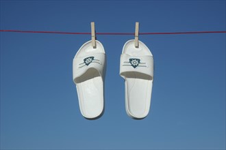 Swim slippers on a clothesline