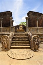 Ruin of a temple with moonstone and Buddha statue