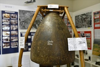 Church bell made of front part of a mine bomb