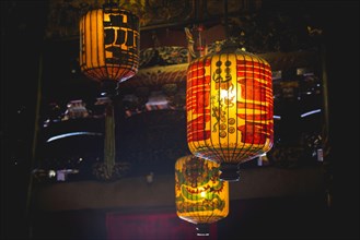 Traditional Chinese lanterns hanging from the ceiling