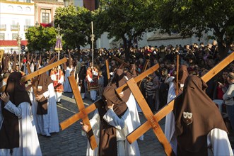 Penitents with cross at the Semana Santa