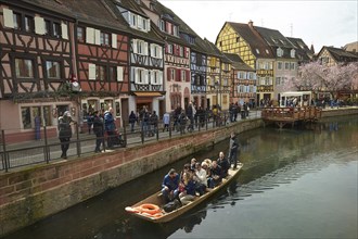 Tourist boat and half-timbered houses on the canal in the Old Town