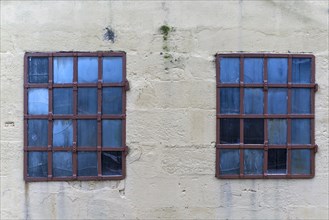 Barred windows of an old factory building