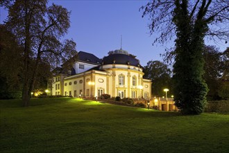 Illuminated theatre in the park in the blue hour