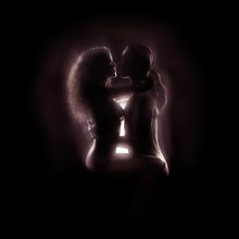 Tantra and Tantric sexuality spiritual concept of a couple making love with energy glowing around their bodies