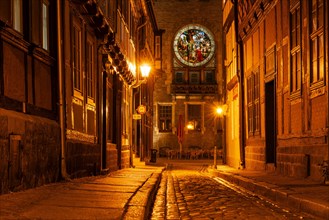 Narrow alley with half-timbered houses