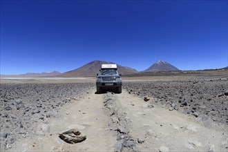 Off-road vehicle on the way on the lagoon route in the Altiplano