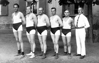 Five men in strange sports pants