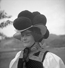 Woman in traditional traditional costume with hat