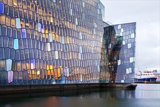 Facade of the honeycomb structure made of dichromatic glass by Olafur Eliasson at the Harpa Concert Hall