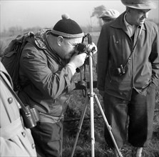 Men photographing with tripod around 1950