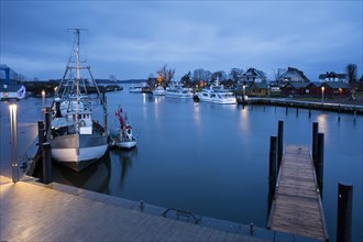 Baltic Sea harbour with boats at dusk