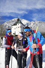 Cross-country skiers in front of the Mariastein pilgrimage church