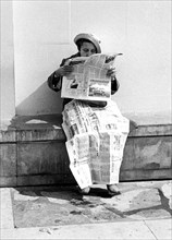 Newspaper as blanket