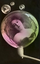 Woman reflected in soap bubbles