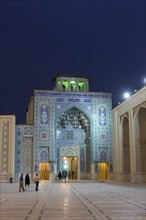 Entrance of Aramgah-e Shah-e Cheragh complex at night