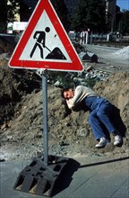 Construction worker sleeps at construction site