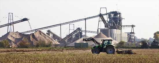 Tractor in front of gravel plant