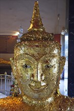 Buddha statue covered with gold leaf