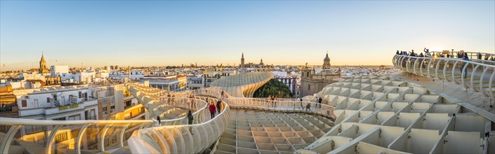 View from Metropol Parasol to numerous churches at sunset