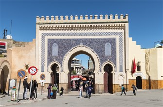 Locals and tourists in front of Bab Boujeloud