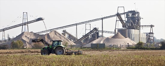 Tractor in front of gravel plant