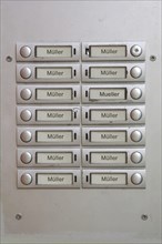 Many door bell nameplates all with the name Muller