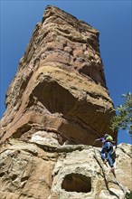 Local guide climbs to Abuna Yemata monolithic church in the Gheralta Mountains near Hawzen