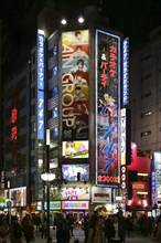 Colorful illuminated advertising and shops