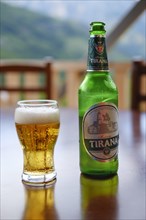 Tirana beer bottle and beer glass