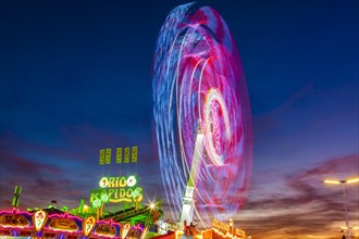 Ride Chaos Pendulum in motion at night