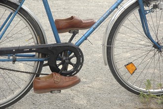 Shoes on a bicycle