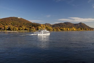 Excursion boat on Rhine with Petersberg and Drachenfels