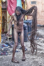Naked Sadhu with long hair during Hindu festival Kumbh Mela