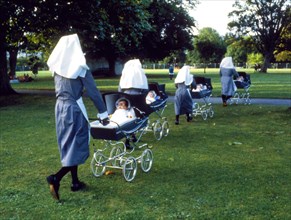 Four nuns and four babies