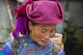Woman in traditional dress of the Flower Hmong