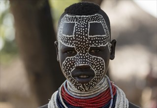 Young woman with face painting from the Karo tribe