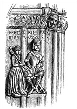 The sculptures of Friedrich Barbarossa and Bishop Albert of Freising on the portal of the Freising Cathedral and the inscription