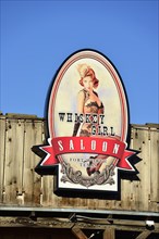 Advertising sign for Whiskey Girl Saloon