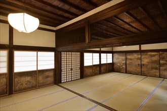 Traditional Japanese interior with tatami mats and painted shoji sliding screens in Sanbo-in