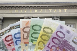 Bank notes in front of the university